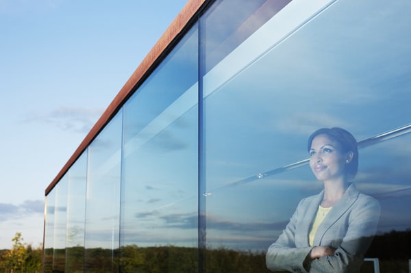A person standing near the window